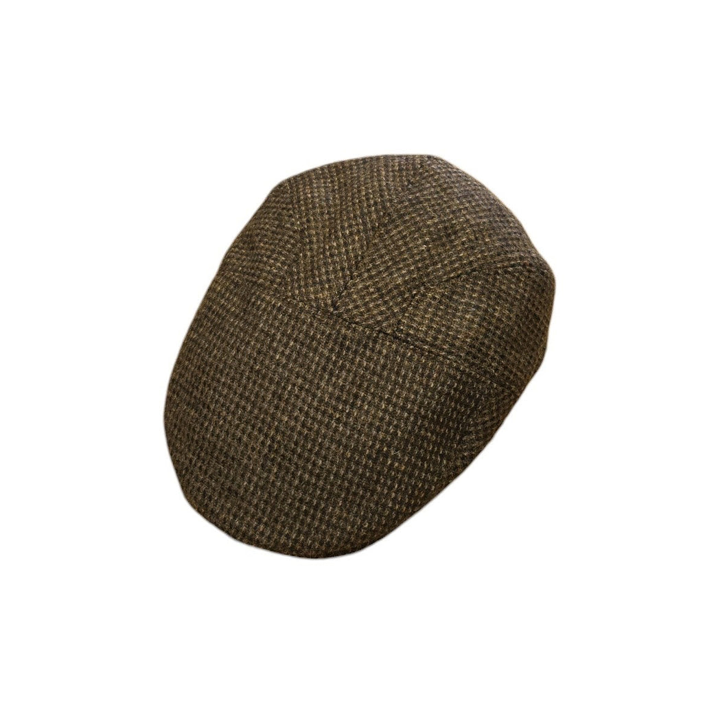 A black/brown tweed flat cap with a subtle woven pattern, shown against a plain white background.