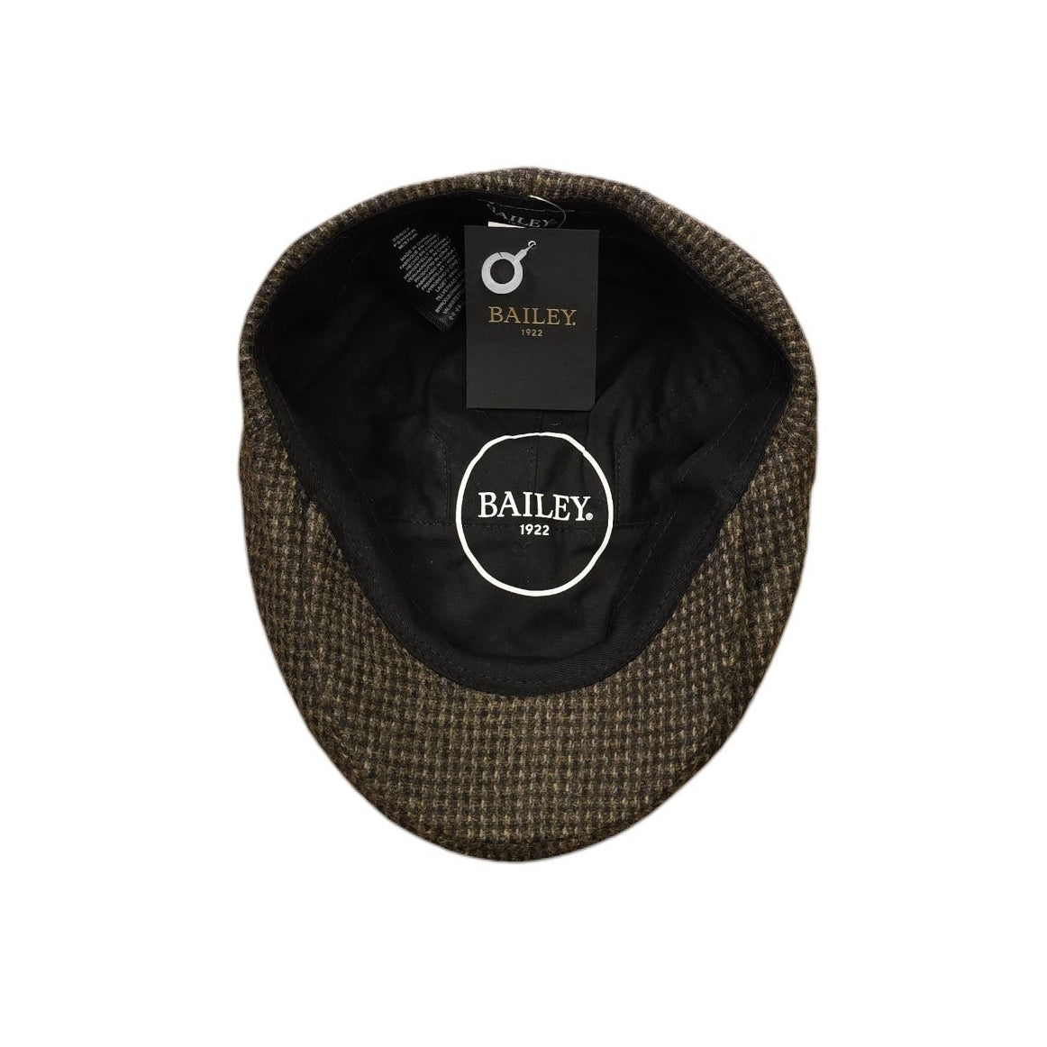 A top-down view of a Bailey 19122 Penner Duckbill cap, showing its dark brown and black textured tweed exterior and black interior lining with a circular logo patch.